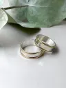 Alianzas cinta plata lisa centro y bordes oro