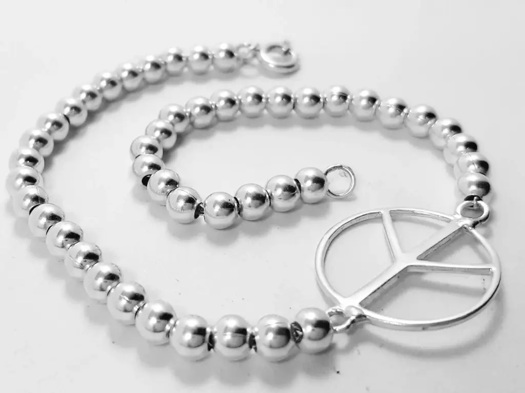 Pulsera simbolo paz c/bolitas